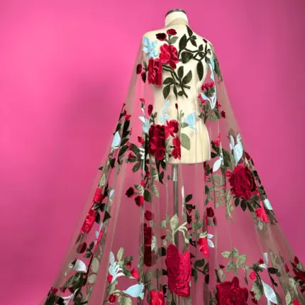Tulle with massive red flowers embroidery.