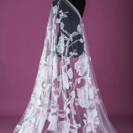 off white tulle with embroidered flowers.