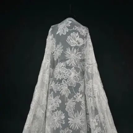 Off White Tulle with large embroidered flowers for a dramatic, eye-catching gown.