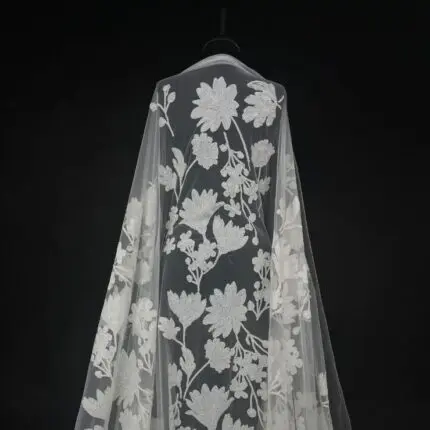 Off White Tulle with sequined flowers for a sparkling, elegant gown.
