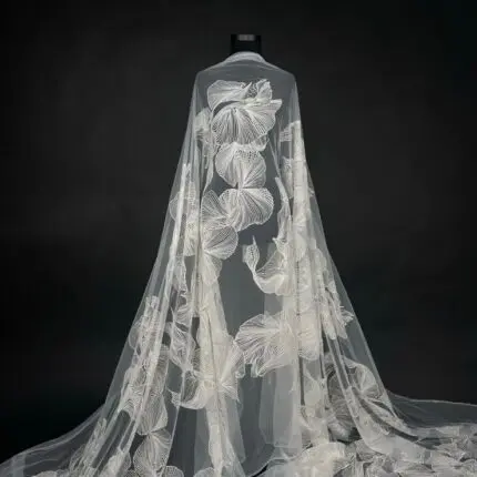 Off White Tulle with delicate embroidery for a touch of elegance.