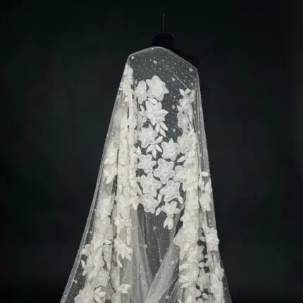 Off White Tulle with appliquéd flowers and pearl centers for a touch of elegance.