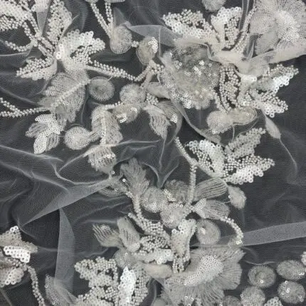 Off White Tulle with sequin patterns and embroidery for a touch of elegant sparkle.