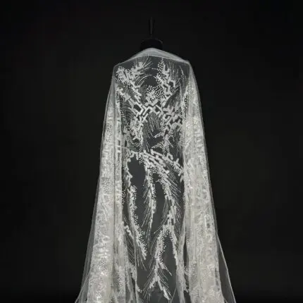 Off White Tulle with geometric embroidery, sequins, and beads.