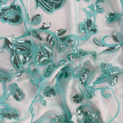 Baby Blue Tulle with intricate embroidery and shimmering sequins.